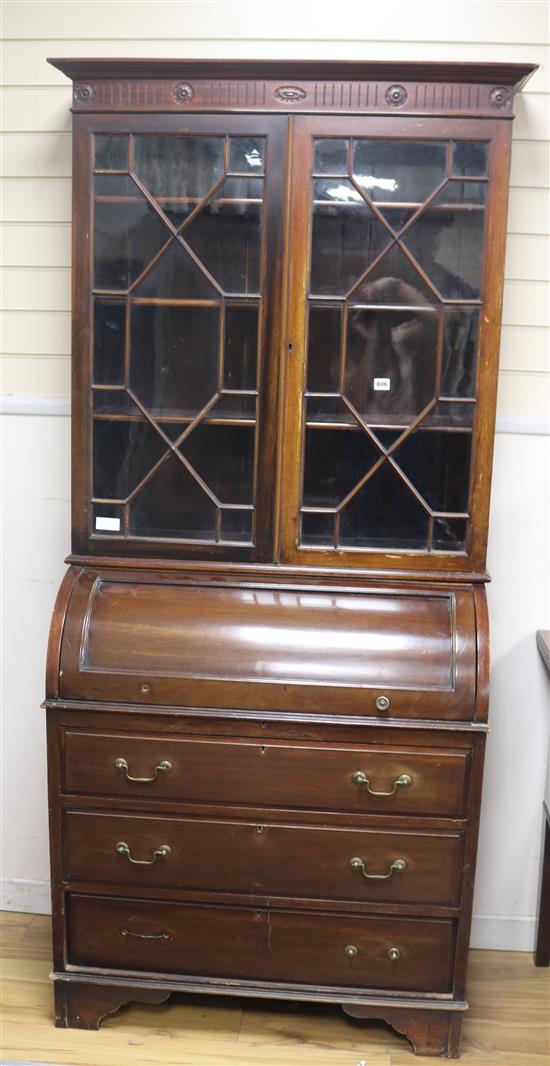 A mahogany cylinder front bureau bookcase, H.205cm